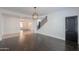 Open dining room with dark hardwood floors and a chandelier at 910 E Canyon Way, Chandler, AZ 85249