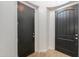 Entryway with tile flooring and two black doors at 910 E Canyon Way, Chandler, AZ 85249