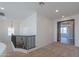 Upstairs hallway with carpeted floor and black railing at 910 E Canyon Way, Chandler, AZ 85249