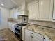 White kitchen cabinets and granite countertops at 910 E Canyon Way, Chandler, AZ 85249