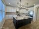 Spacious kitchen featuring a large island and granite countertops at 910 E Canyon Way, Chandler, AZ 85249