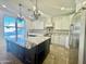 Kitchen boasts granite countertops and white cabinets at 910 E Canyon Way, Chandler, AZ 85249