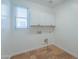 Clean laundry room, white cabinets, tile floor at 910 E Canyon Way, Chandler, AZ 85249