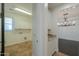 Bright laundry room with white cabinets and tile floor at 910 E Canyon Way, Chandler, AZ 85249