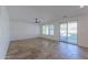 Bright living room featuring tile floors and sliding glass doors to backyard at 910 E Canyon Way, Chandler, AZ 85249