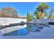 Inviting pool and spa surrounded by a stone patio at 910 E Canyon Way, Chandler, AZ 85249