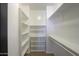 Bright walk-in closet with shelves, hanging rods, and a cubby organizer at 910 E Canyon Way, Chandler, AZ 85249