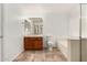 Clean bathroom with tiled floors, bathtub, and wooden vanity at 9233 E Lobo Ave, Mesa, AZ 85209