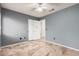 Bedroom with grey walls, tile floor, and a window with blinds at 9233 E Lobo Ave, Mesa, AZ 85209