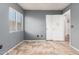 Bedroom with grey walls, tile floor, and window with blinds at 9233 E Lobo Ave, Mesa, AZ 85209