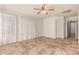 Spacious bedroom with tile flooring and ceiling fan at 9233 E Lobo Ave, Mesa, AZ 85209