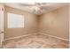 Bedroom with beige walls, tile floor and window with blinds at 9233 E Lobo Ave, Mesa, AZ 85209