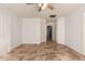 Bedroom with tile flooring and access to hallway at 9233 E Lobo Ave, Mesa, AZ 85209