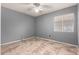 Simple bedroom with tile floors and a window with blinds at 9233 E Lobo Ave, Mesa, AZ 85209