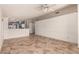 Open living room with tile floor and kitchen view at 9233 E Lobo Ave, Mesa, AZ 85209