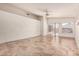 Living room with tile floors and ceiling fan at 9233 E Lobo Ave, Mesa, AZ 85209