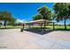 Covered picnic area with tables and benches at 9233 E Lobo Ave, Mesa, AZ 85209