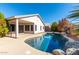 Home exterior showcasing a kidney shaped pool in backyard at 9233 E Lobo Ave, Mesa, AZ 85209