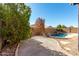 Landscaped backyard with a kidney shaped pool at 9233 E Lobo Ave, Mesa, AZ 85209