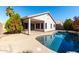 Home exterior showcasing a kidney shaped pool in backyard at 9233 E Lobo Ave, Mesa, AZ 85209