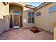 Charming courtyard entry with terracotta tile and potted plants at 9758 E Meseto Ave, Mesa, AZ 85209