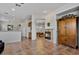 Open dining room with chandelier and views to Gathering room and kitchen at 9758 E Meseto Ave, Mesa, AZ 85209