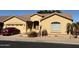 Single-story home with a two-car garage and landscaped front yard at 9758 E Meseto Ave, Mesa, AZ 85209