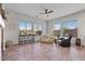 Relaxing Gathering room with tile floors, ceiling fan, and ample natural light at 9758 E Meseto Ave, Mesa, AZ 85209