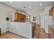 Kitchen with wood cabinets, an island, and a breakfast bar at 9758 E Meseto Ave, Mesa, AZ 85209