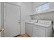 Laundry room with washer, dryer, and exterior access at 9758 E Meseto Ave, Mesa, AZ 85209