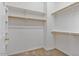 Large walk-in closet with double hanging rods and shelving at 9758 E Meseto Ave, Mesa, AZ 85209