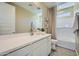 Clean bathroom with a bathtub, single sink vanity, and subway tile at 10165 E Ursula Ave, Mesa, AZ 85212