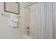 Clean bathroom with a shower/tub combo and patterned curtain at 10372 E Raintree Dr, Scottsdale, AZ 85255