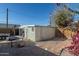 Backyard view of detached garage and patio area at 122 W Washington Ave, Gilbert, AZ 85233