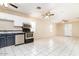 Open concept kitchen and living area with stainless steel appliances at 122 W Washington Ave, Gilbert, AZ 85233