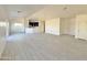 Open living area with gray plank flooring and a modern kitchen at 13586 S Kashmir Rd, Arizona City, AZ 85123