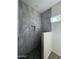 New shower with gray tile and a small niche at 13586 S Kashmir Rd, Arizona City, AZ 85123