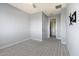 Well-lit bedroom with carpet and walk-in closet at 16510 N 92Nd St # 1003, Scottsdale, AZ 85260