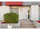 Front entrance of a modern townhome with landscaping at 16510 N 92Nd St # 1003, Scottsdale, AZ 85260