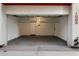 Garage with overhead storage racks and epoxy flooring at 16510 N 92Nd St # 1003, Scottsdale, AZ 85260