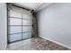 Attached garage with frosted glass panels and tiled floor at 16510 N 92Nd St # 1003, Scottsdale, AZ 85260