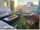 Relaxing rooftop patio with seating and fire pit at 16510 N 92Nd St # 1003, Scottsdale, AZ 85260