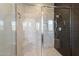 Spacious shower with marble tile and built-in seat at 16510 N 92Nd St # 1003, Scottsdale, AZ 85260