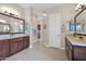 Elegant bathroom with double vanity and large mirror at 1663 E Vesper Trl, Queen Creek, AZ 85140