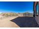 Desert landscape backyard with block wall and mountain views at 17244 W Lynx Rd, Goodyear, AZ 85338
