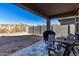Spacious backyard with covered patio and seating area at 17244 W Lynx Rd, Goodyear, AZ 85338