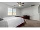 Bright bedroom with a ceiling fan and ample closet space at 17244 W Lynx Rd, Goodyear, AZ 85338