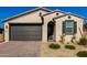 One-story home with two-car garage and desert landscaping at 17244 W Lynx Rd, Goodyear, AZ 85338
