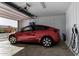 Garage with Tesla charging station at 17244 W Lynx Rd, Goodyear, AZ 85338