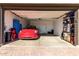 Garage with Tesla and storage shelving at 17244 W Lynx Rd, Goodyear, AZ 85338